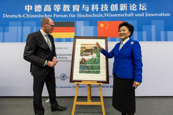 The Chinese delegation’s gift was from Pan Gongkai, the president of the China Academy of Art. The calligraphy is from a classic Taoist text that highlights the connection between nature and culture.