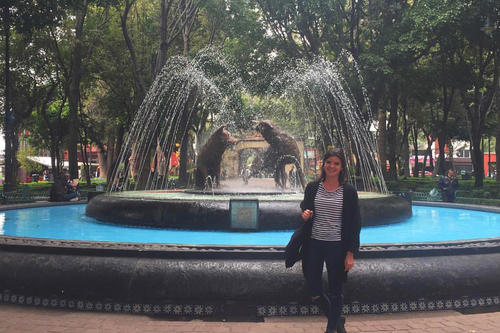Estefanía González in front of the famous Fuente de los Coyotes in the district of Coyoacán, where the Mexican painter Frida Kahlo lived.