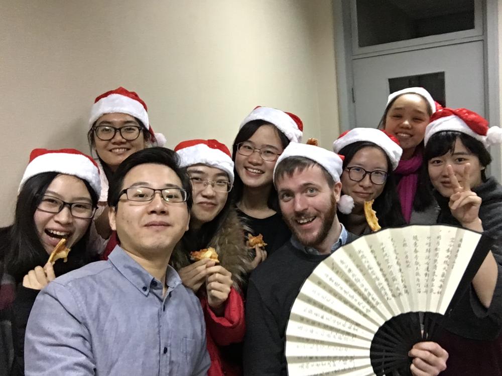 Simon Hodgsen surrounded by his students, Christmas 2016.