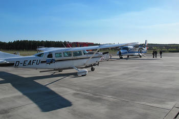 The research aircraft of Freie Universität (front) and the German Aerospace Center (DLR) site in Oberpfaffenhofen (back) before the start of the sensing missions.