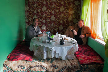 Talking about peace: Jan Koehler (at right) speaks to Kanybek Abduvasitovich Isakov, the rector of Osh State University in southern Kyrgyzstan, about ethnic tensions in the region.