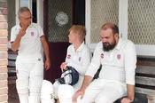 Cricket apparel – often white -– typically includes a jersey, trousers, pads, gloves, and a helmet for safety.
