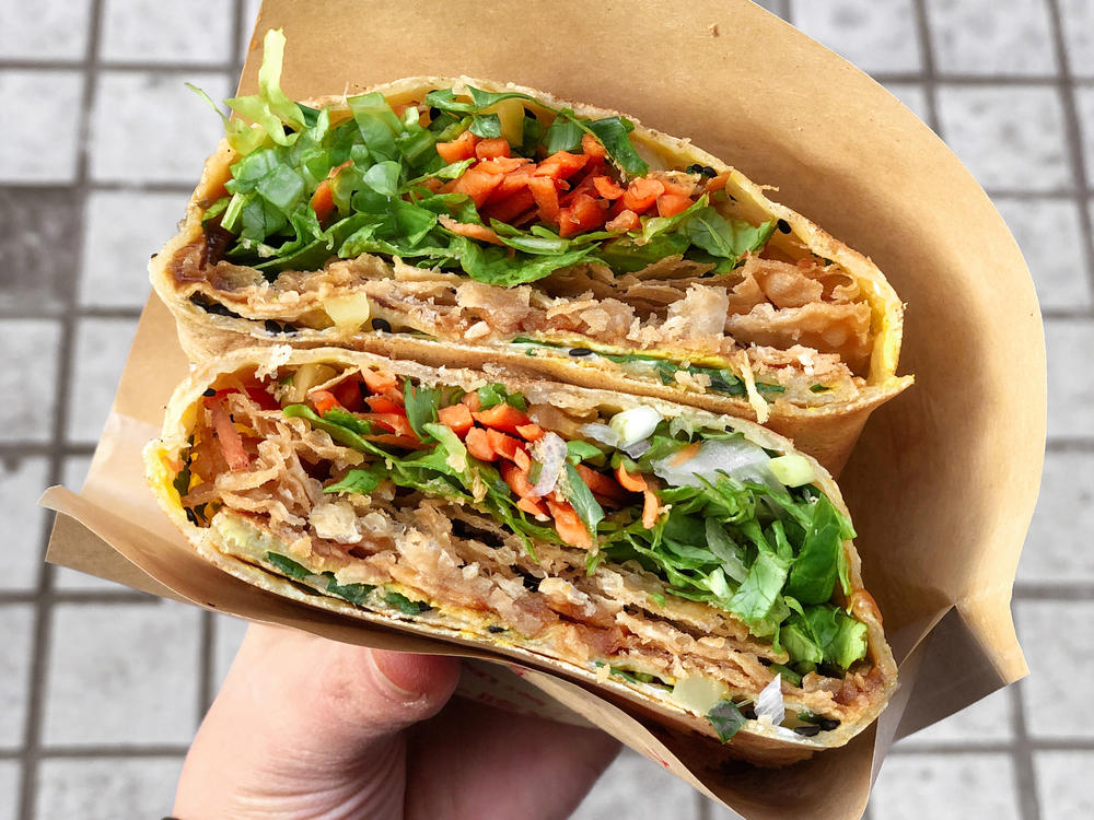On the way to Fudan University, you can grab a cheap bite to eat for breakfast, like this Chinese wrap.