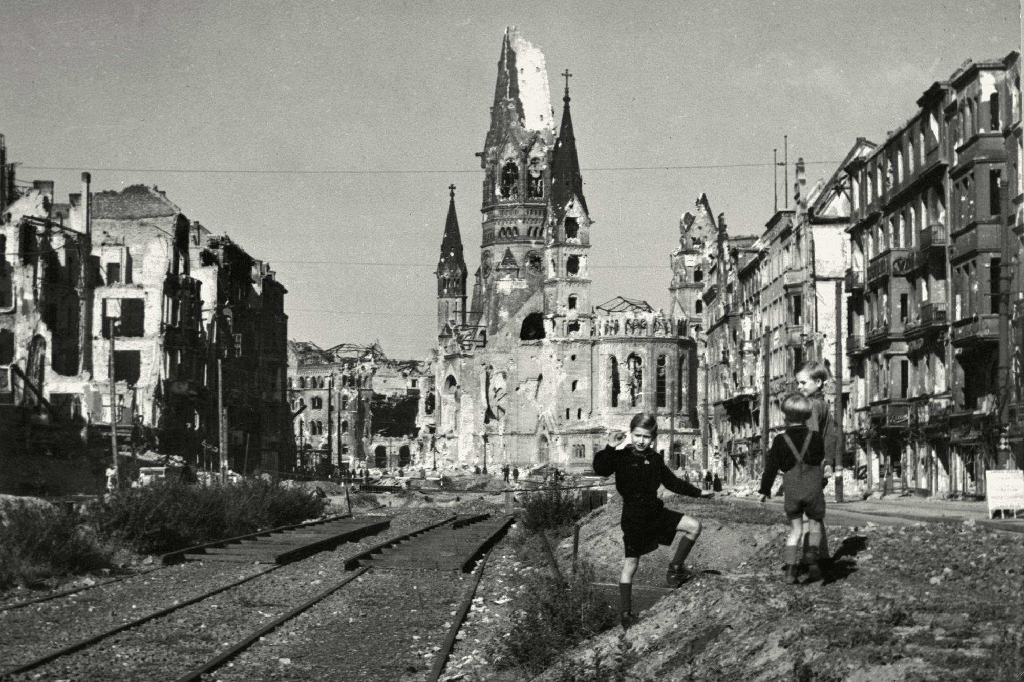 Memorial. In post-war Berlin, children played in front of the ruins of the Kaiser Wilhelm Memorial Church on the destroyed Tauentzienstrasse.