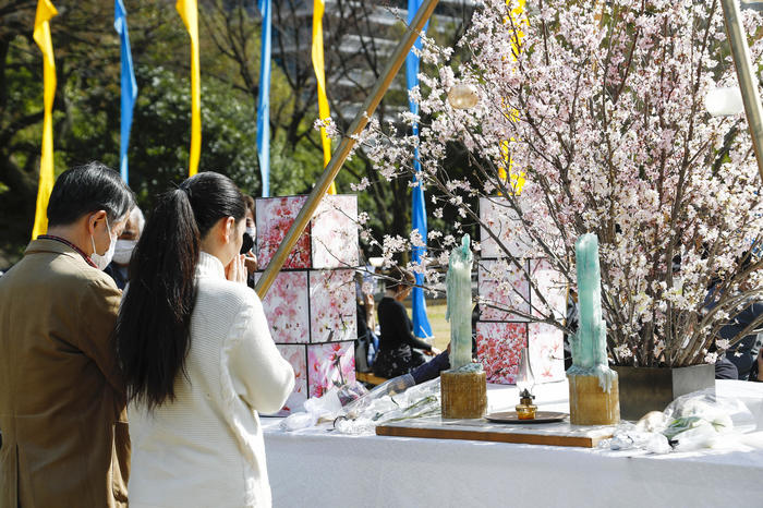 Silent prayer. On March 11, 2020, large numbers of people gathered at a memorial in Hibiya Park in Tokyo to commemorate the thousands of victims of the 2011 tsunami in eastern Japan that led to the Fukushima nuclear disaster.