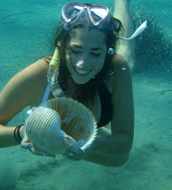 Christina Braoun diving for coral in Greece.