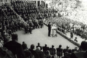 Almost 20,000 visitors give the President of the United States their rapt attention.