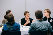 The participants of the three round tables engaged in lively discussions.