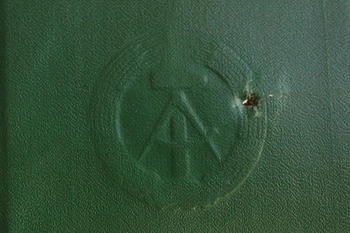 Fred Woitke’s social insurance booklet, showing a bullet hole.