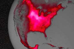 Fluoreszierende Felder: Das Foto zeigt eine Satellitenaufnahme von Nordamerika, auf der man gut den Getreidegürtel als hell leuchtenden Bereich in derMitte des amerikanischen Kontinents sehen kann.