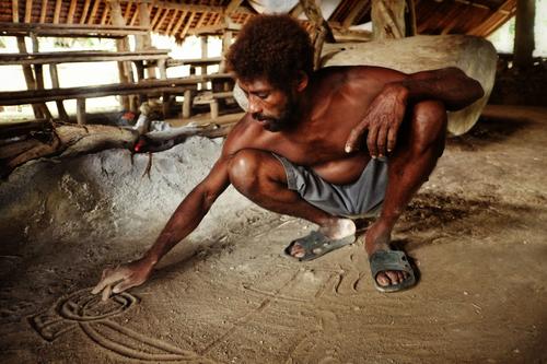 A tribal chieftain in the South Pacific nation of Vanuatu communicates using signs drawn in the sand. Of the approximately 7,000 languages spoken worldwide, more than one-third are viewed as endangered.