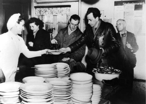 Students being served in the dining hall.