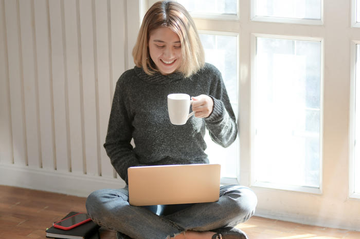 woman-in-gray-sweater-drinking-coffee-3759089